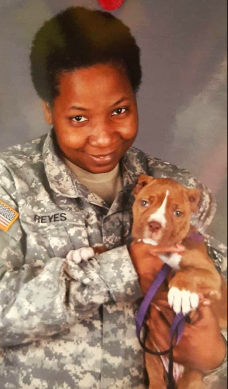 Isolda Reyes in uniform with Heiress as a puppy